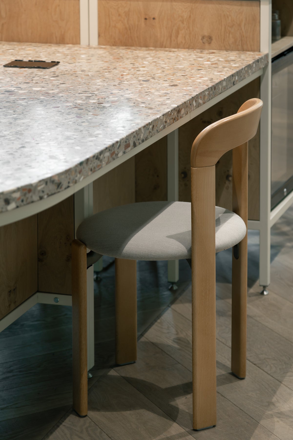 Steel frame reception desk with terrazzo worktop and Hay stool, with disabled access
