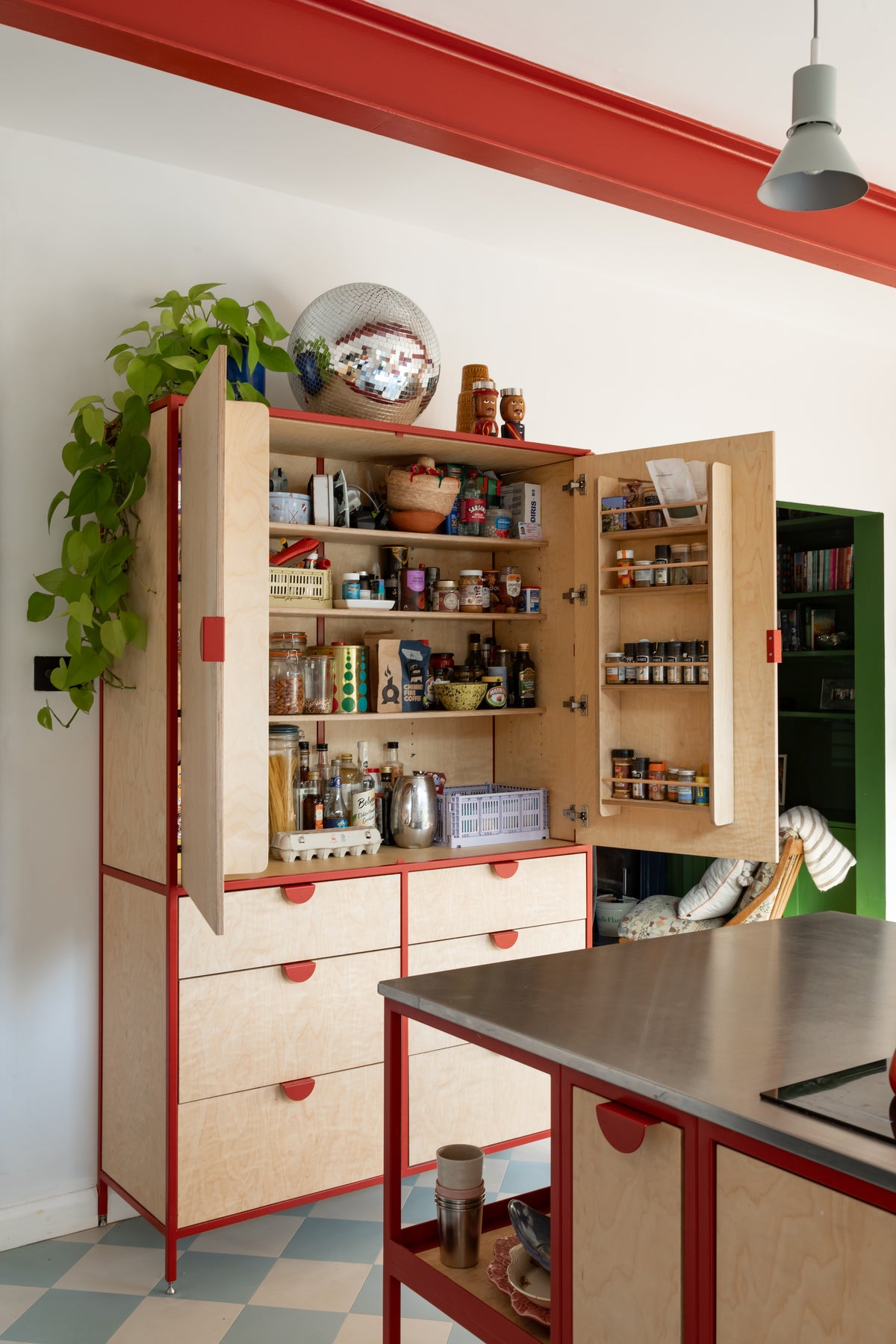 The classic double larder in bright red with half moon handles, powder-coated steel frame and birch plywood 