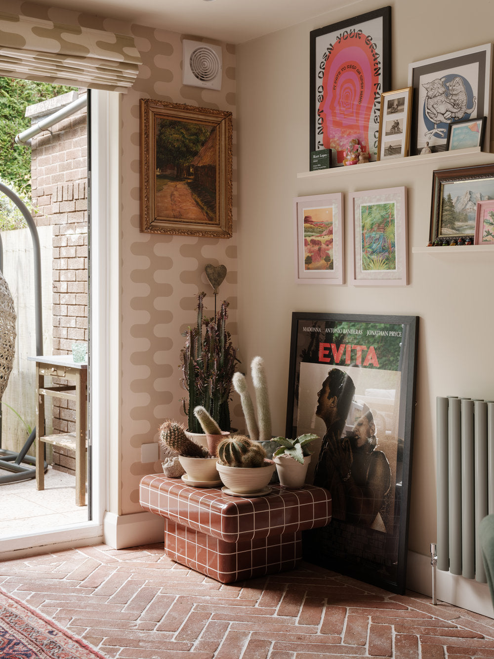 Poodle and Blonde 'Cactus Collection' wallpaper, with a terracotta floor and large rugs.