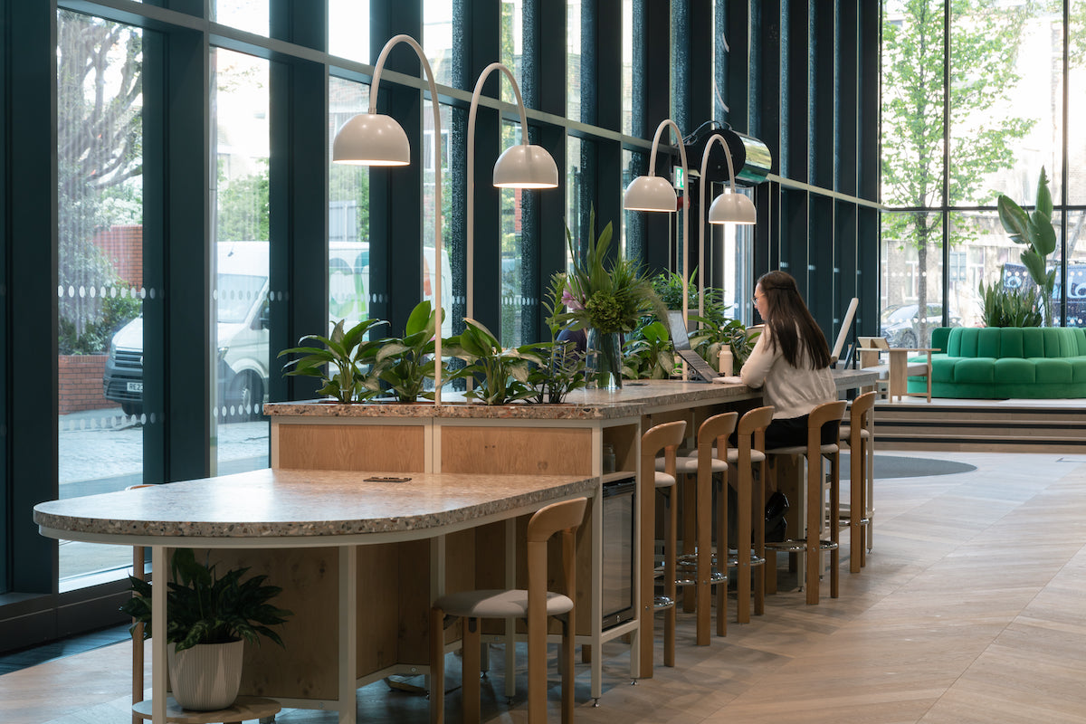 12 meter reception desk, zero lights and hay stools. Terrazzo worktop, oak flooring 