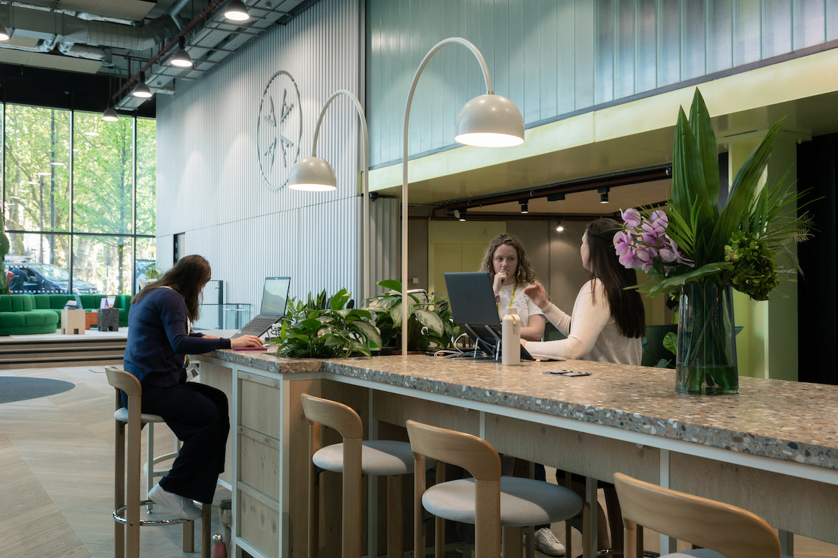 Co-working reception desk. In a large office atrium 