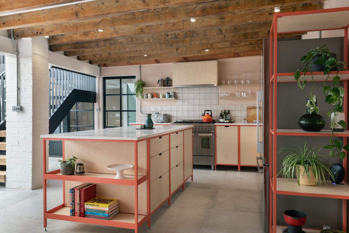 Open plan loft living kitchen Scandi style, free standing kitchen in metal frame work and birch plywood fronts.