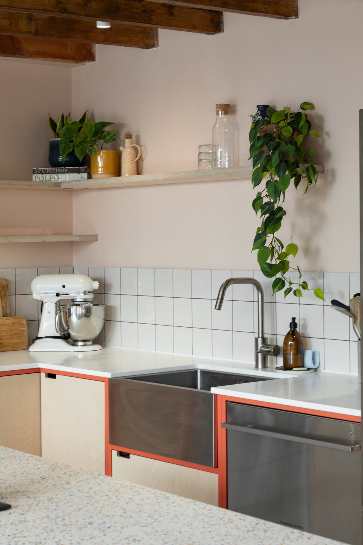Floating birch plywood shelves, white solid surface worktop, stainless steel sink 
