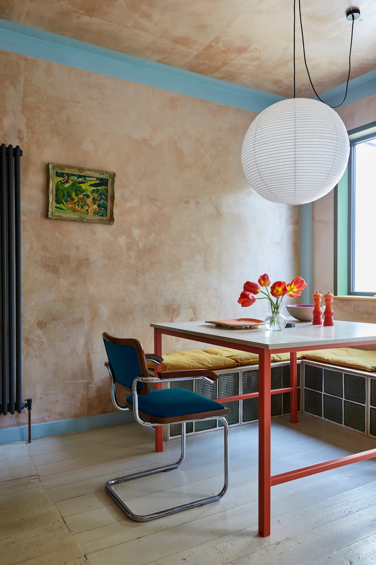 raw plastered walls, retro glass brick built in seating, steel frame table and birch plywood top 